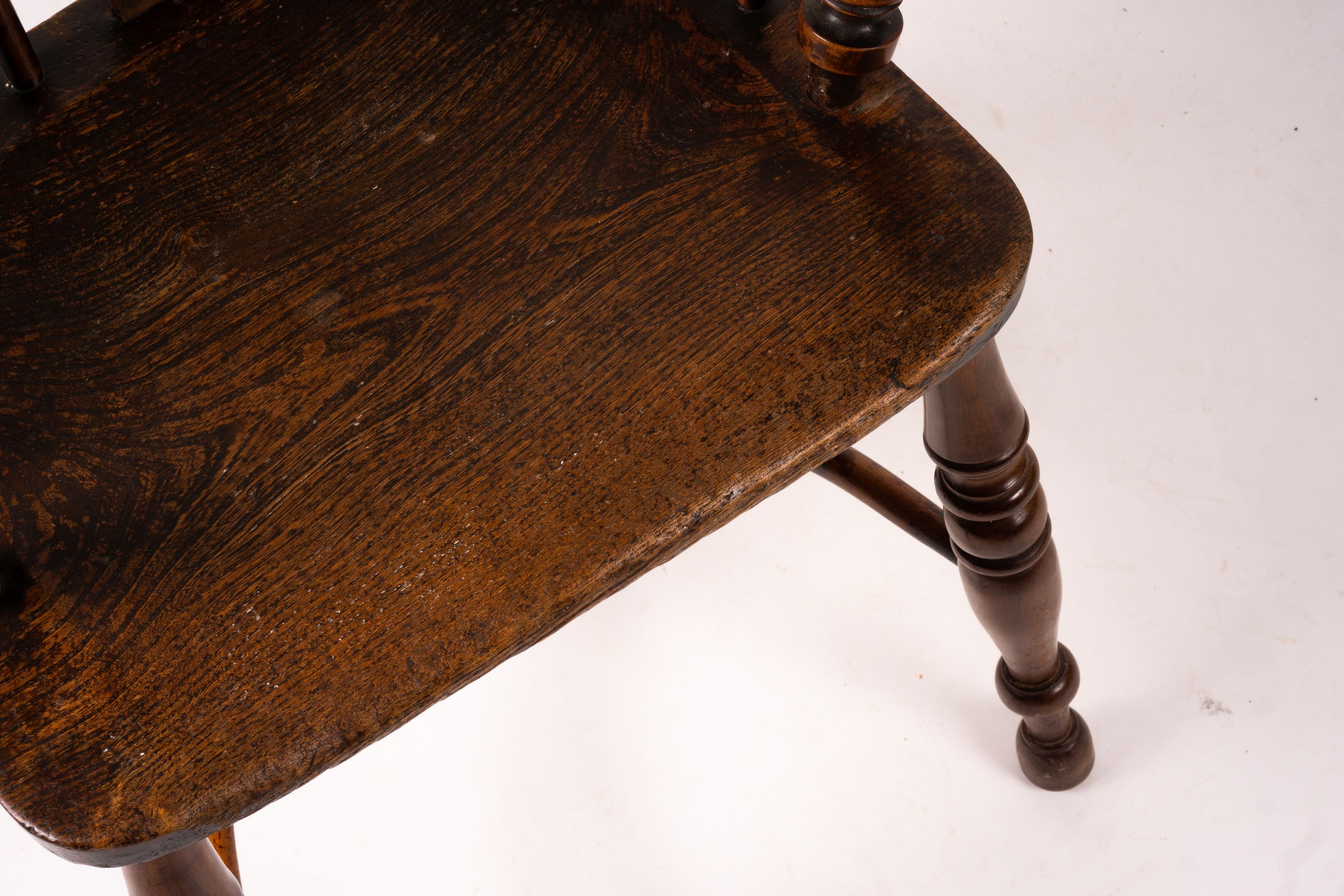 A 19th century yew and elm Yorkshire area Windsor elbow chair with crinoline stretcher, width 60cm, depth 45cm, height 93cm